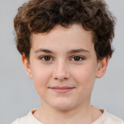 Joyful white child male with short  brown hair and brown eyes