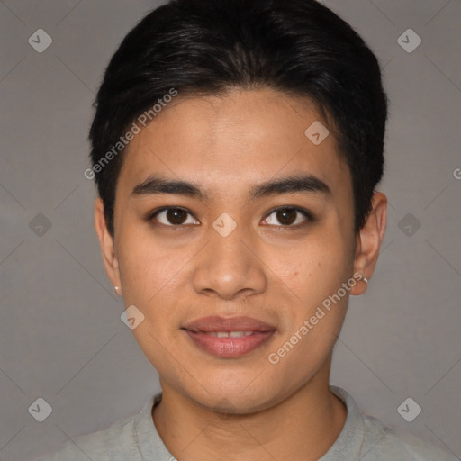 Joyful asian young-adult male with short  brown hair and brown eyes