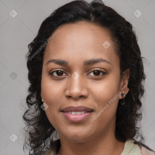 Joyful black young-adult female with long  brown hair and brown eyes