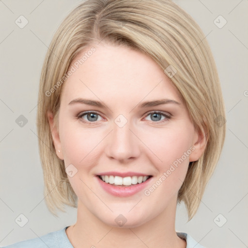 Joyful white young-adult female with medium  brown hair and blue eyes