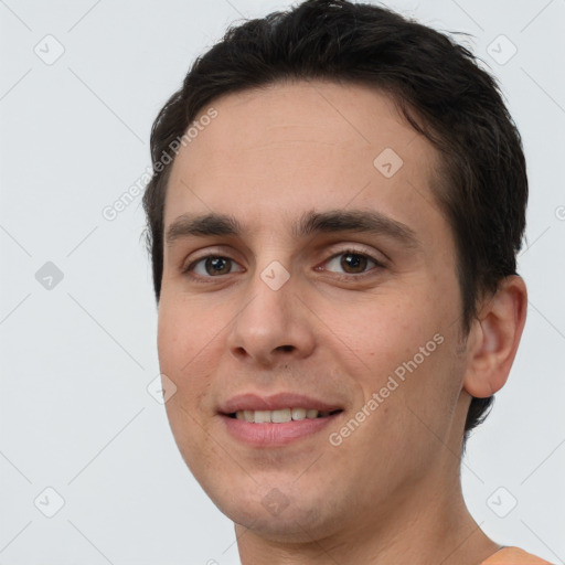 Joyful white young-adult male with short  brown hair and brown eyes