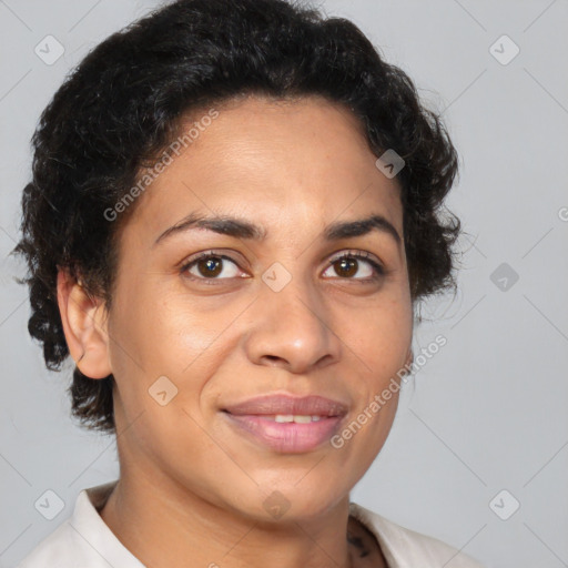 Joyful latino young-adult female with short  brown hair and brown eyes