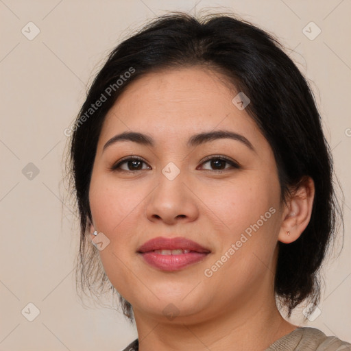 Joyful latino young-adult female with medium  brown hair and brown eyes