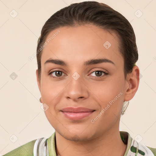 Joyful white young-adult female with short  brown hair and brown eyes