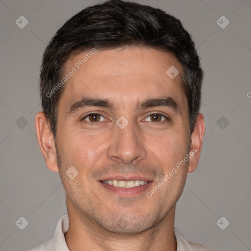 Joyful white adult male with short  brown hair and brown eyes