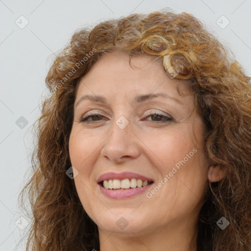 Joyful white adult female with long  brown hair and brown eyes