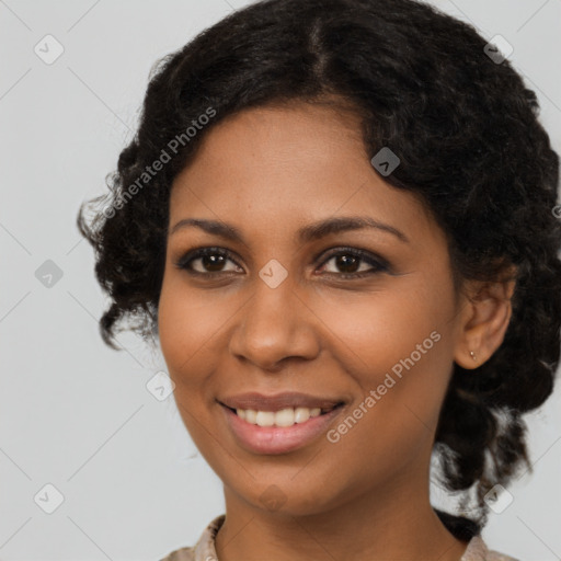 Joyful black young-adult female with medium  brown hair and brown eyes