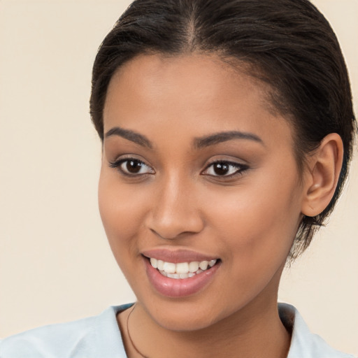 Joyful latino young-adult female with long  brown hair and brown eyes