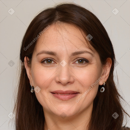 Joyful white adult female with long  brown hair and grey eyes