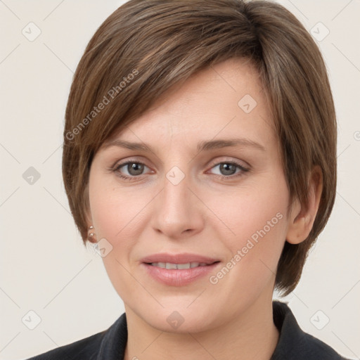 Joyful white young-adult female with medium  brown hair and grey eyes