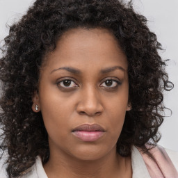 Neutral black young-adult female with long  brown hair and brown eyes