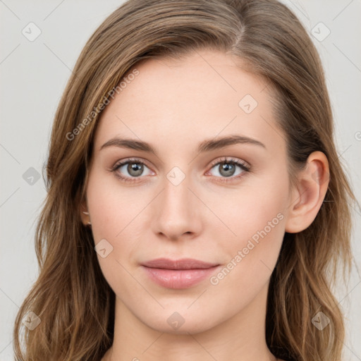 Joyful white young-adult female with long  brown hair and blue eyes