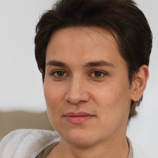 Joyful white adult female with short  brown hair and brown eyes