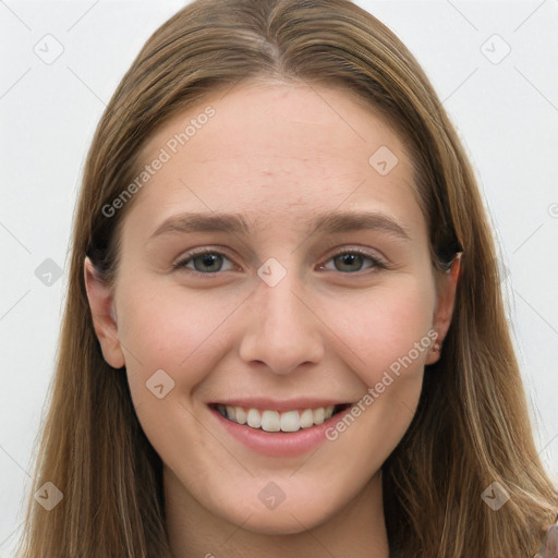 Joyful white young-adult female with long  brown hair and grey eyes