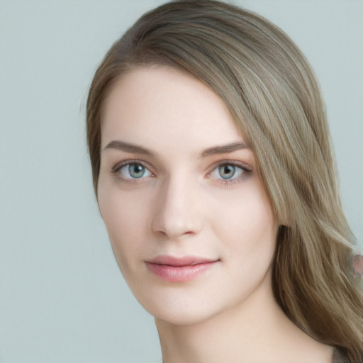 Joyful white young-adult female with long  brown hair and blue eyes