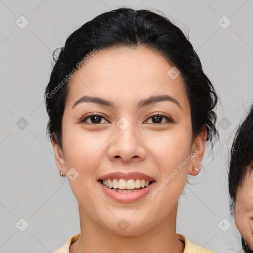 Joyful asian young-adult female with medium  brown hair and brown eyes