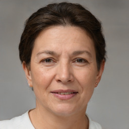 Joyful white adult female with short  brown hair and brown eyes