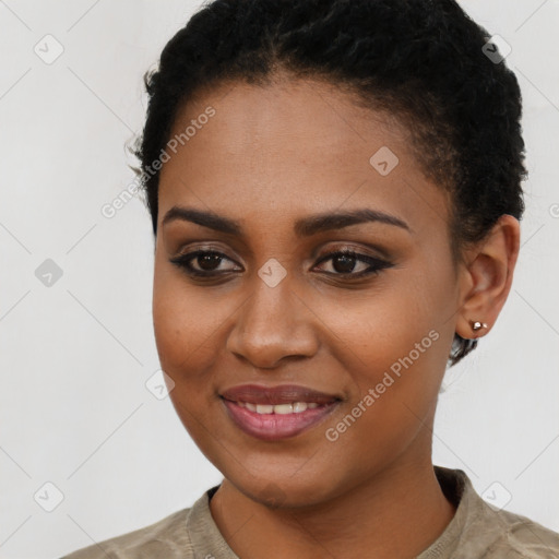 Joyful black young-adult female with short  brown hair and brown eyes