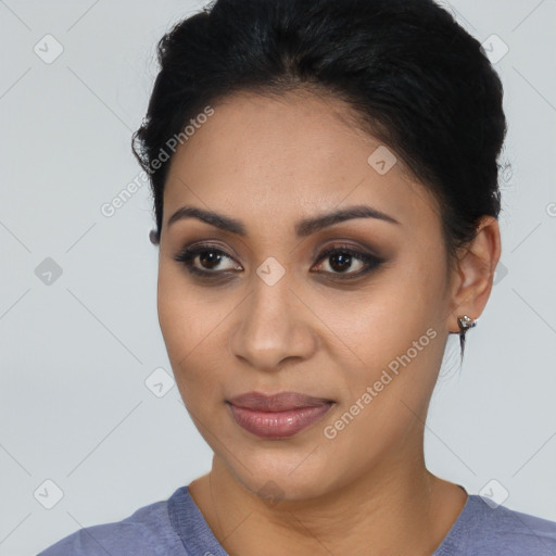 Joyful latino young-adult female with short  black hair and brown eyes