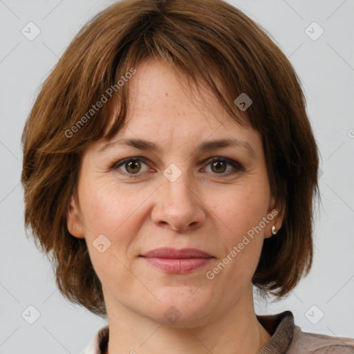 Joyful white adult female with medium  brown hair and grey eyes