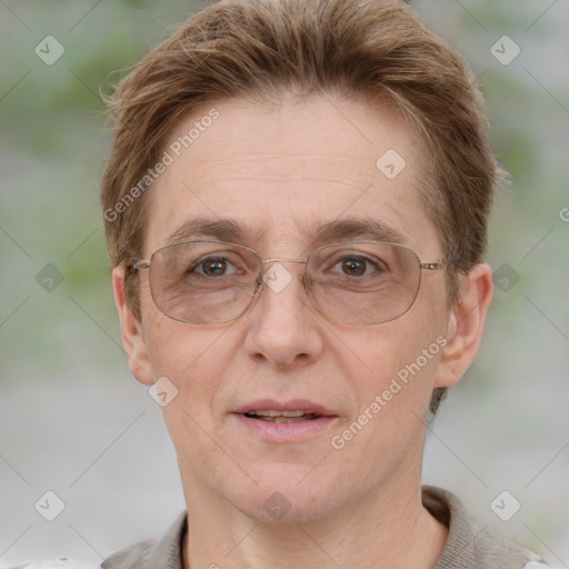 Joyful white adult female with short  brown hair and grey eyes