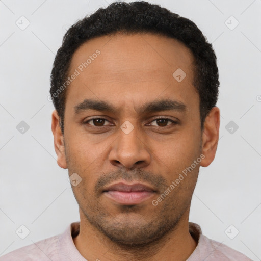 Neutral latino young-adult male with short  black hair and brown eyes
