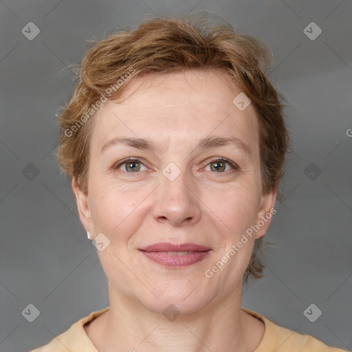 Joyful white adult female with short  brown hair and grey eyes