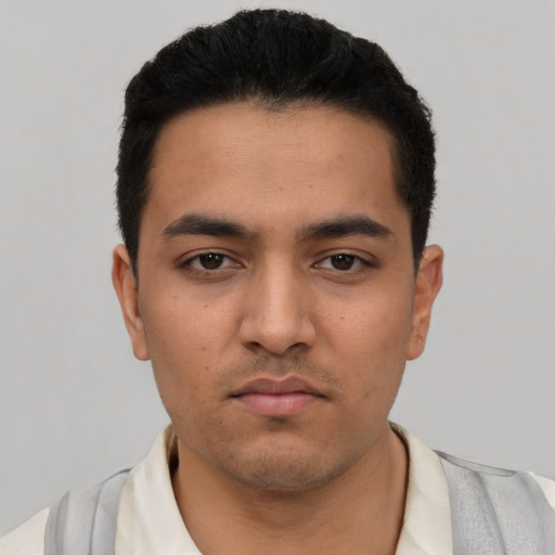 Neutral latino young-adult male with short  black hair and brown eyes