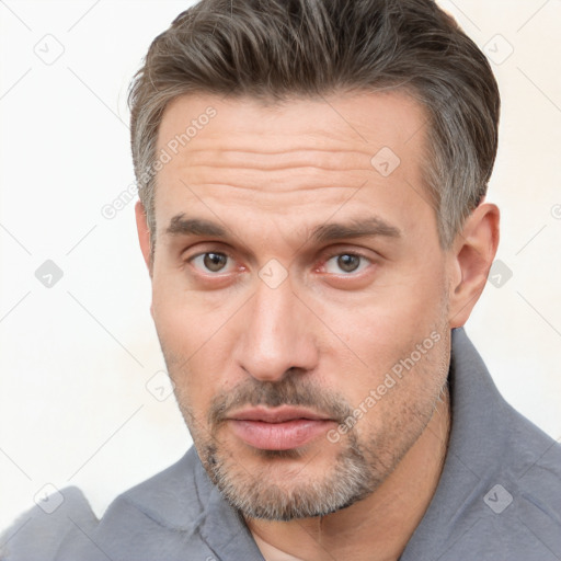 Neutral white adult male with short  brown hair and brown eyes