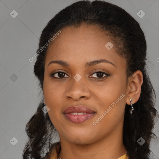 Joyful black young-adult female with long  brown hair and brown eyes