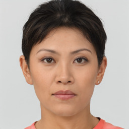 Neutral asian young-adult female with short  brown hair and brown eyes