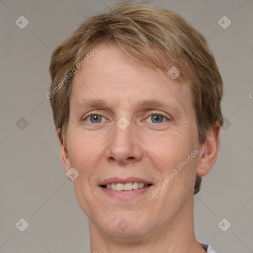 Joyful white adult male with short  brown hair and grey eyes