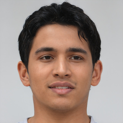 Joyful asian young-adult male with short  brown hair and brown eyes