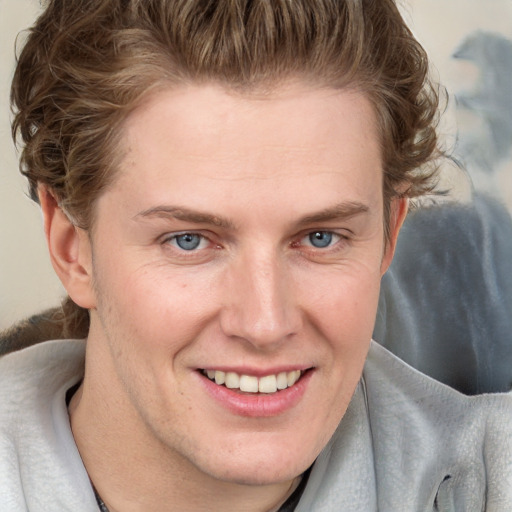 Joyful white young-adult female with short  brown hair and blue eyes