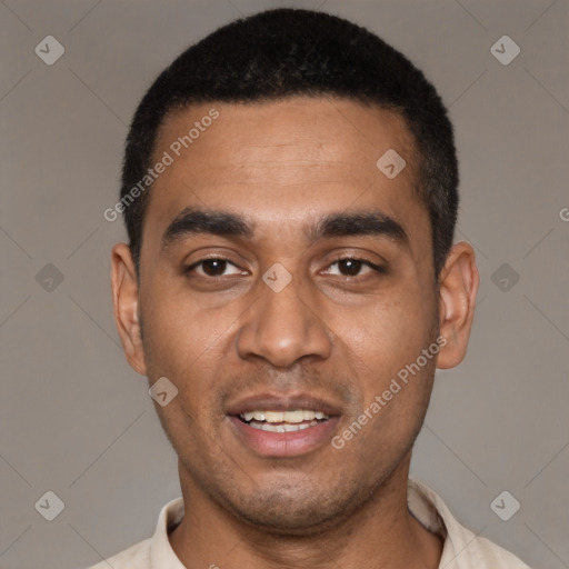 Joyful black young-adult male with short  black hair and brown eyes