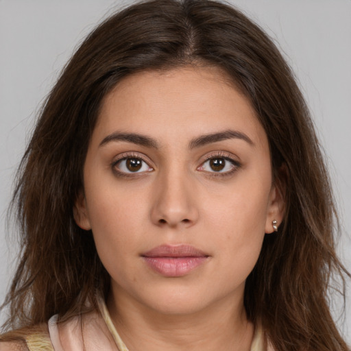 Neutral white young-adult female with long  brown hair and brown eyes
