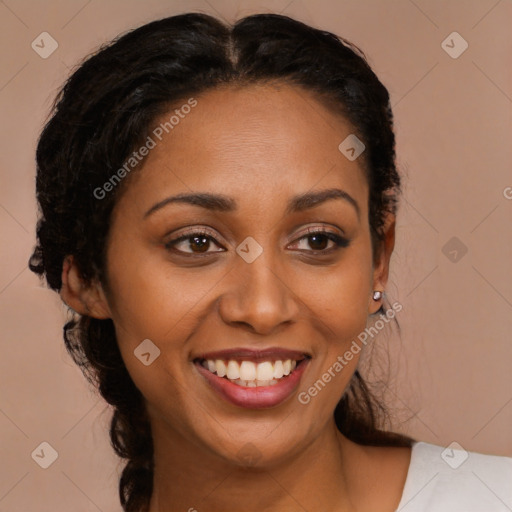 Joyful black young-adult female with medium  brown hair and brown eyes