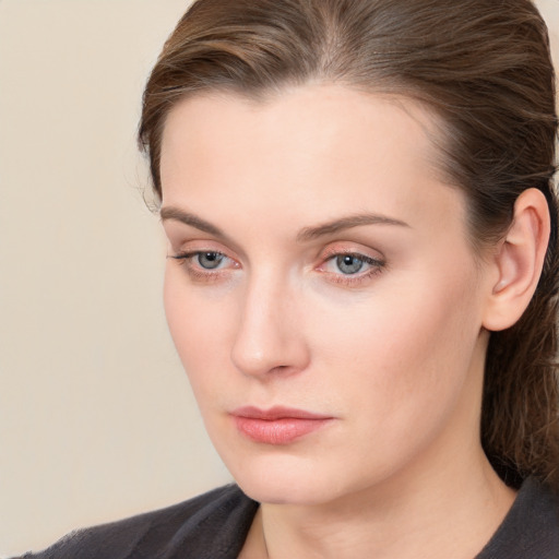 Neutral white young-adult female with long  brown hair and blue eyes