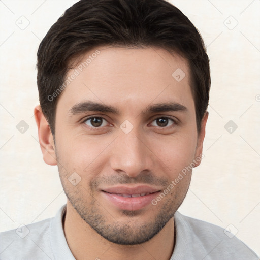 Joyful white young-adult male with short  brown hair and brown eyes