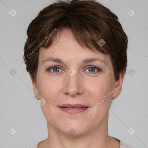 Joyful white adult female with short  brown hair and grey eyes