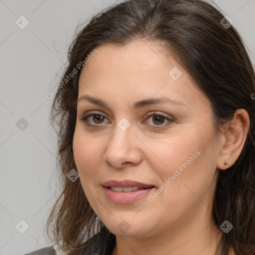 Joyful white adult female with medium  brown hair and brown eyes