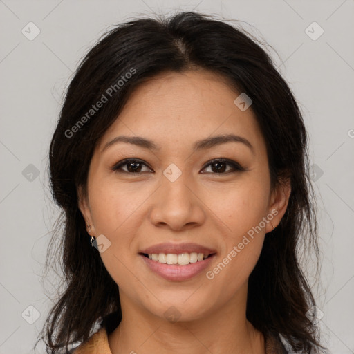 Joyful latino young-adult female with long  brown hair and brown eyes