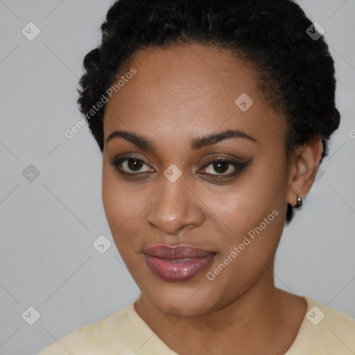 Joyful black young-adult female with short  black hair and brown eyes