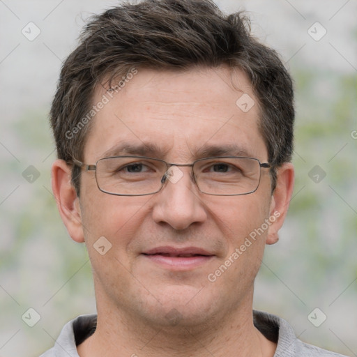 Joyful white adult male with short  brown hair and grey eyes