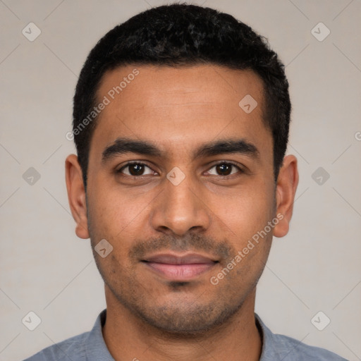 Joyful latino young-adult male with short  black hair and brown eyes