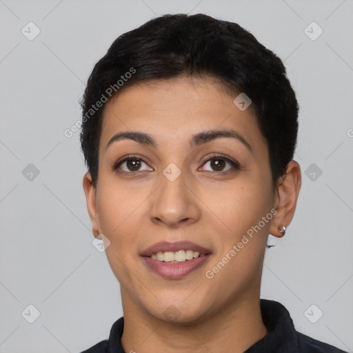 Joyful latino young-adult female with short  black hair and brown eyes