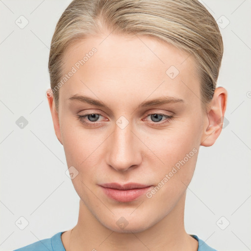 Joyful white young-adult female with short  brown hair and blue eyes