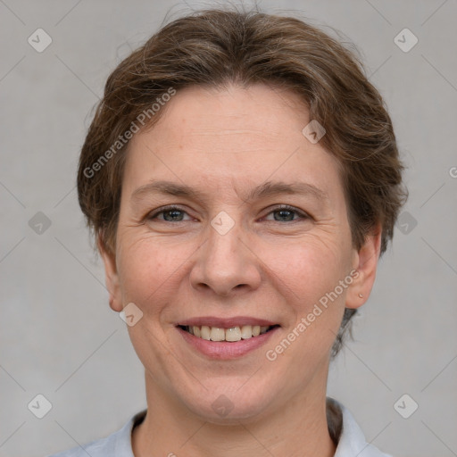 Joyful white adult female with short  brown hair and grey eyes