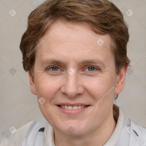 Joyful white adult female with short  brown hair and grey eyes