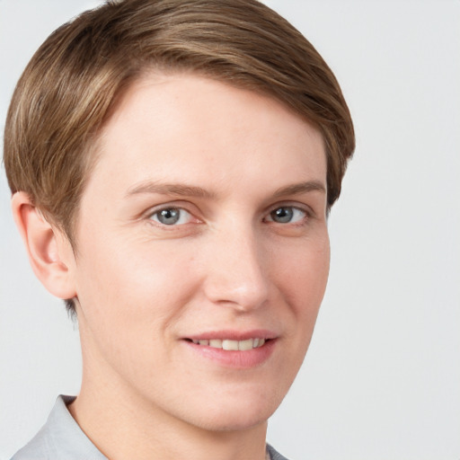 Joyful white young-adult female with short  brown hair and grey eyes